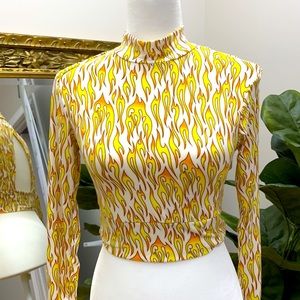 Flame pattern long sleeve cut out bodycon crop top in a soft spandex blend